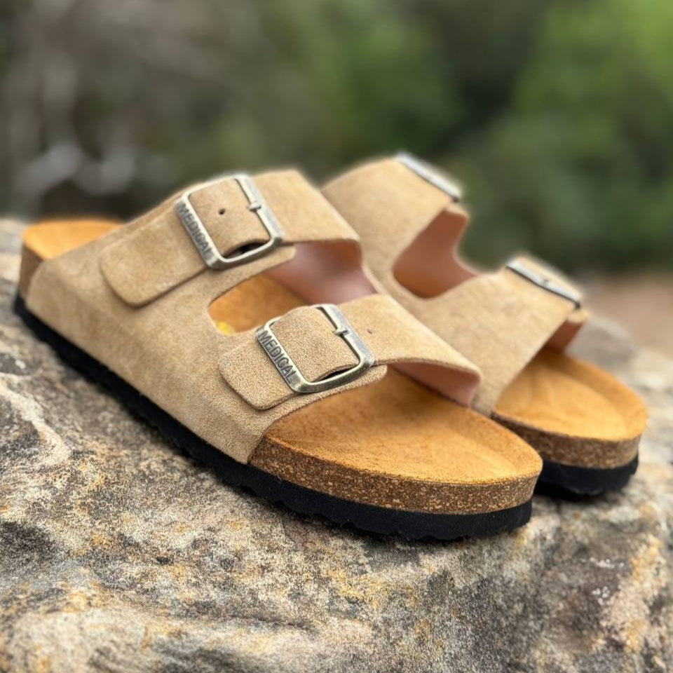 Adjustable buckles on AGL tan suede sandals, close-up view